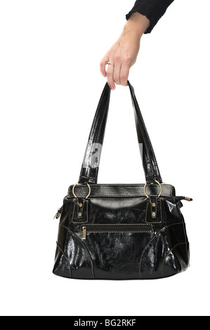 Black woman`s bag in hand. Cut out on white background. Stock Photo